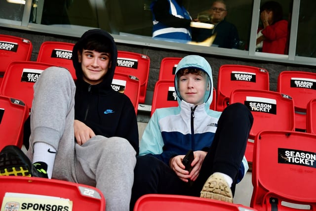 These two young fans in the Mark Farren Stand are waiting to be entertained by Ruaidhri Higgins' side.