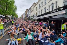 Crowds doing 'Rock The Boat' on Shipquay Street in Derry on Saturday.