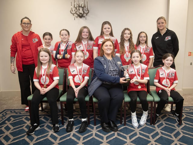 Maiden City Soccer Ladies u-11s receive the Summer Cup from Charlene Morrow, Derry Credit Union, at the D&D Youth FA awards at the Waterfoot Hotel on Sunday night last. Included are coaches Jennifer Browne and Grace Dickson. (Photos: Jim McCafferty Photography)