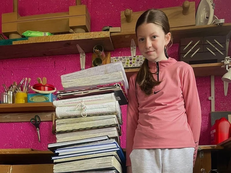 Abbi with her childhood memory book before it was buried in Quigley's Point.