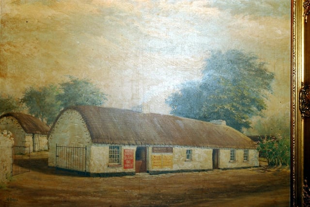 Bygone years, the cottage painting in the The Tul na Rí / Simpson's bar back in January 2003.
