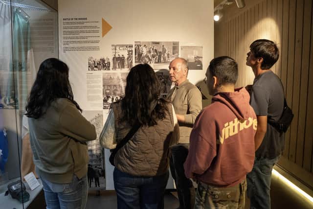 A delegation of indigenous activists attending the Bloody Sunday Trust’s Derry Peace and Conflict International and its Developing International Solidarity programme being taken on a tour of the Museum of Free Derry by Tony Doherty, Chair of the BST.