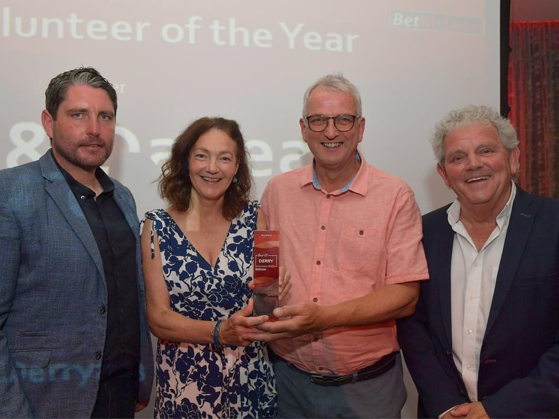 Sports Volunteer of the Year Award winners Jim and Danea Herron of Derry Spartans receive their trophy from Derry City manager Ruaidhri Higgins (left), on behalf of principal sponsor BetMcLean , and compere Adrian Logan. Photo: George Sweeney. DER2325GS – 52