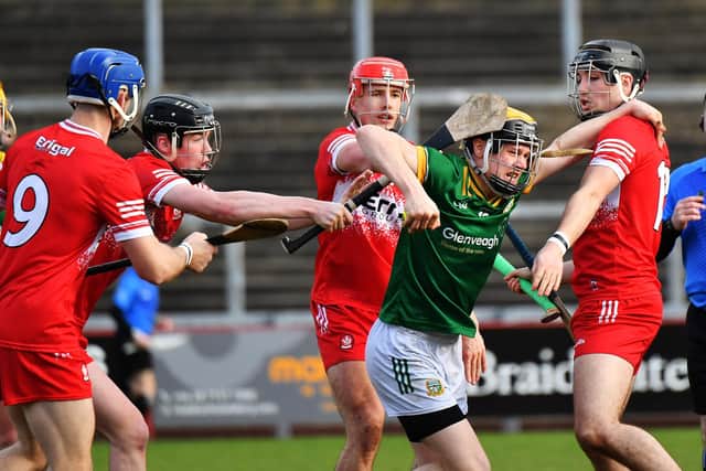 Derry’s players confront Mayo’s Lorcan Byrne in Celtic Park on Saturday afternoon. Photo:  George Sweeney