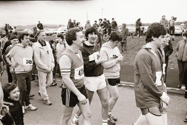 Participants limber up for the start of the Male Mini Marathon in Derry in 1983.