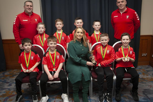 Caroline Casey, manager, O’Neills Sports Superstore, Derry presenting the U8 Summer Cup to Tristar at the Annual Awards in the City Hotel on Friday night last. Included are coaches Johnnie McDevitt and Sean Curran.