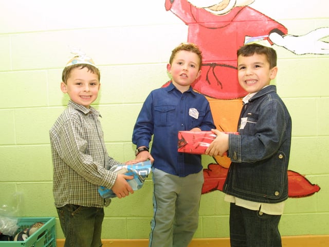 Jacob Duffy, Ryan Magee and Jamie McKeever exchanging presents