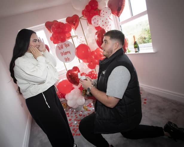POP THE QUESTION !!!! . . . .Old Romantic Dylan Stafford gets down in one knee to propose to girlfriend Chelsea when they moved in to their new Braidwater Roe Wood home in Limavady on Valentine's Day. (Photo: Jim McCafferty Photography)