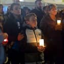 Some of the attendance at a candlelit vigil, held at Guildhall Square on Monday evening, to remember those who died in the Creeslough tragedy on Friday afternoon last.  Photo: George Sweeney.  DER2241GS – 50