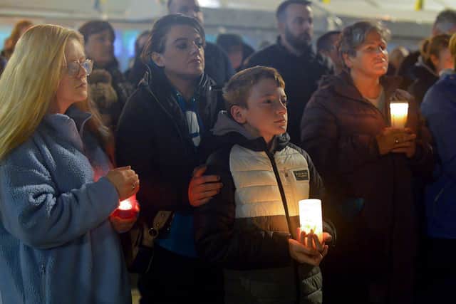 Some of the attendance at a candlelit vigil, held at Guildhall Square on Monday evening, to remember those who died in the Creeslough tragedy on Friday afternoon last.  Photo: George Sweeney.  DER2241GS – 50