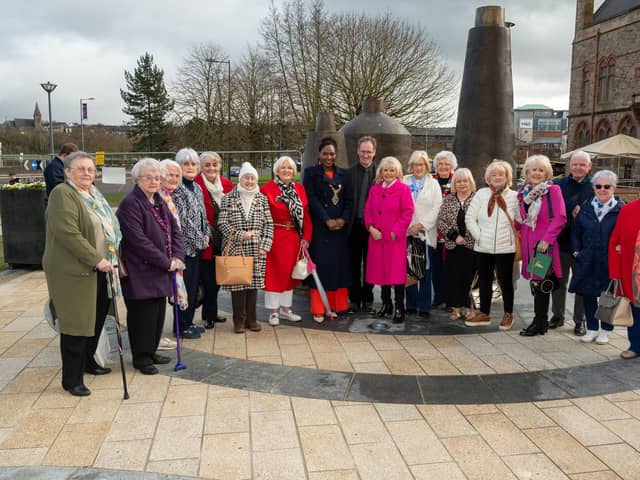 The new Factory Girls Sculpture which has been officially unveiled in Derry’s Harbour Square close to the city’s Guildhall. The sculpture, created by artist Chris Wilson, consists of three anthropomorphic bell shaped forms with nighttime illumination. The design is based on the shapes of spools of thread as used in the shirt factory and celebrates those who worked in the industry. The Mayor, Councillor Lilian Seenoi-Barr, joined Mary White, Chairperson of the Factory Girls and artist Chris Wilson at the unveiling which was attended by some of the women who worked in the local industry and members of the design team. Picture Martin McKeown. 13.03.25