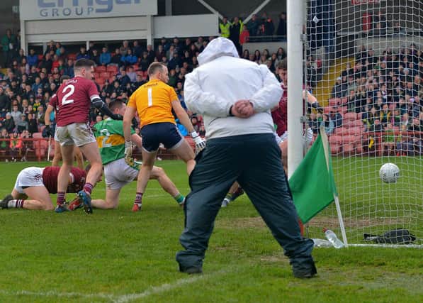 Glen's Cathal Mulholland (2) scores the goal to clinch the Derry Senior football championship final against Slaughtneil in Celtic Park on Sunday afternoon last. Photo: George Sweeney.  DER2243GS – 004
