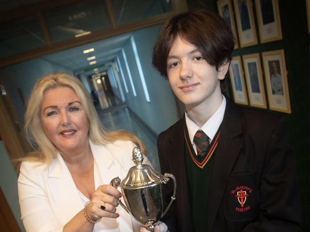 Principal Mrs Ciara Deane presents Jordan Kelly with the Award as Top Performer in GCSE English & English Literature.