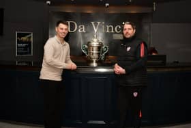 Derry City manager Ruaidhri Higgins pictured with club director Paddy Simpson and the FAI Cup at Da Vinci's Hotel this week.