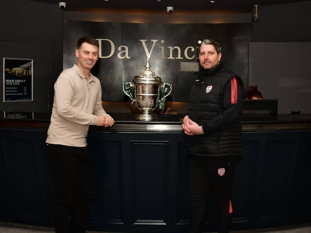 Derry City manager Ruaidhri Higgins pictured with club director Paddy Simpson and the FAI Cup at Da Vinci's Hotel this week.