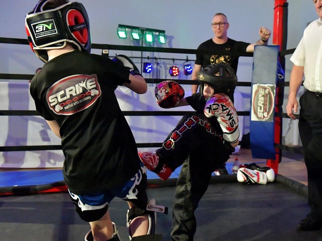 Cian Sharkey (on the right), from Strike Martial Arts, takes on Cabel McCann from Full Circle Martial Arts in The Rising Stars event held in Shantallow Community Centre on Saturday.Photo: George Sweeney. DER2308GS – 144