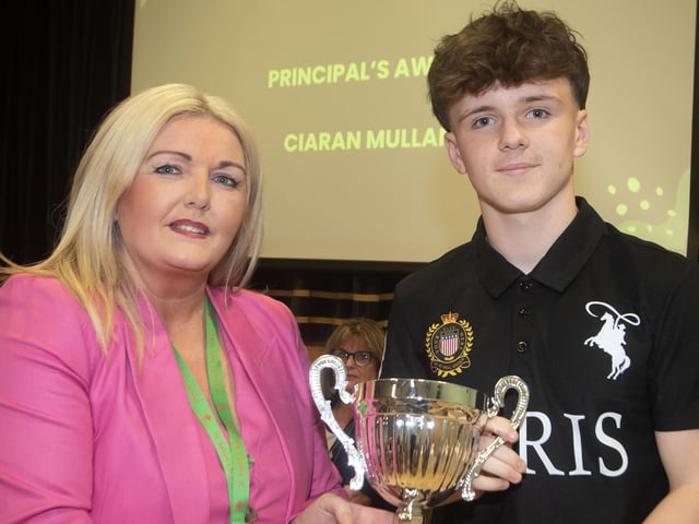 Mrs. Ciara Deane, Principal presenting the Principal's Award to Ciaran Mullan. : .