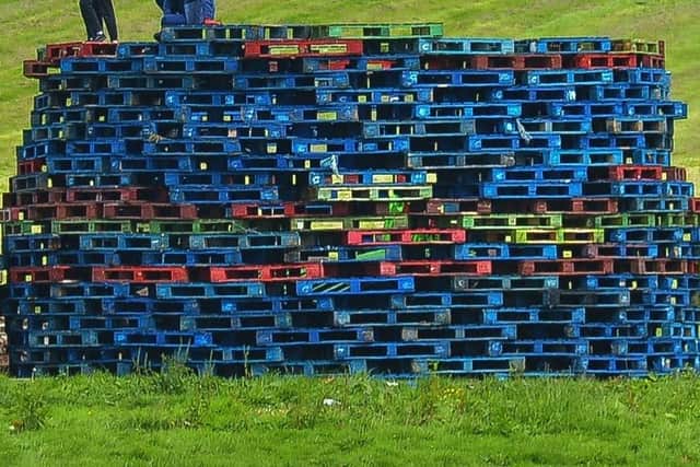 Pallets being stacked during preparations for a previous bonfire in Galliagh. DER2033GS - 036