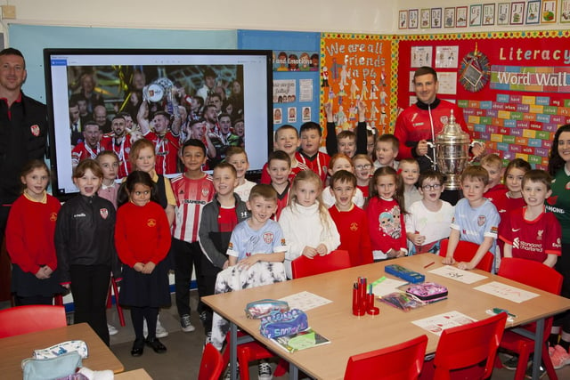 Mrs O'Doherty and her P4 class pictured with the Shane and Patrick McEleney and the FAI Cup during a visit to Steelstown Primary School this week. (Photo: Jim McCafferty)