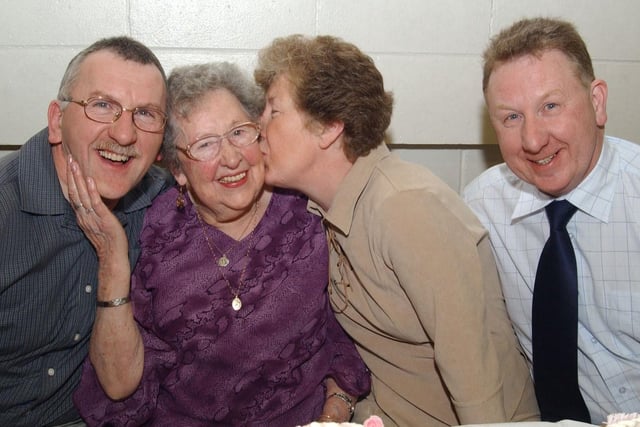 Phoebe Doherty gets a big kiss from her daugther Ann O Brian who celebrated her 90th birthday with her two sons Joe and David. (2502CG10)