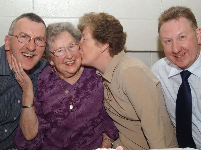 Phoebe Doherty gets a big kiss from her daugther Ann O Brian who celebrated her 90th birthday with her two sons Joe and David. (2502CG10)