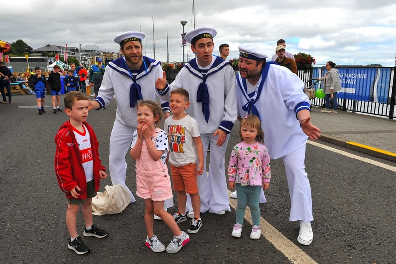 Jamie, Emilie, Harrison and Erin pictured with the singing sailors at the Foyle Maritime Festival. Photo: George Sweeney. DER2229GS – 056