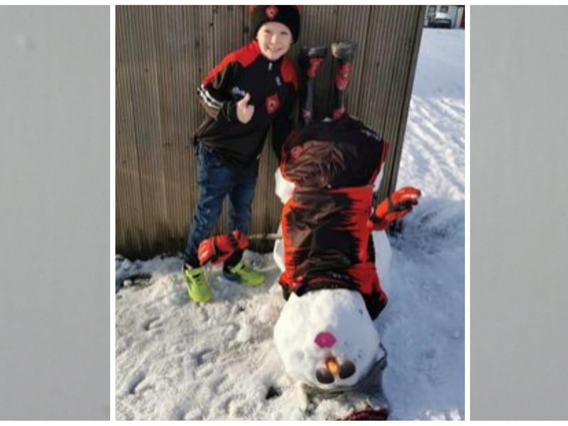 Kameron Mc Dermott from Clonmany with his upside down snowman. Photo: Tricia Barr.