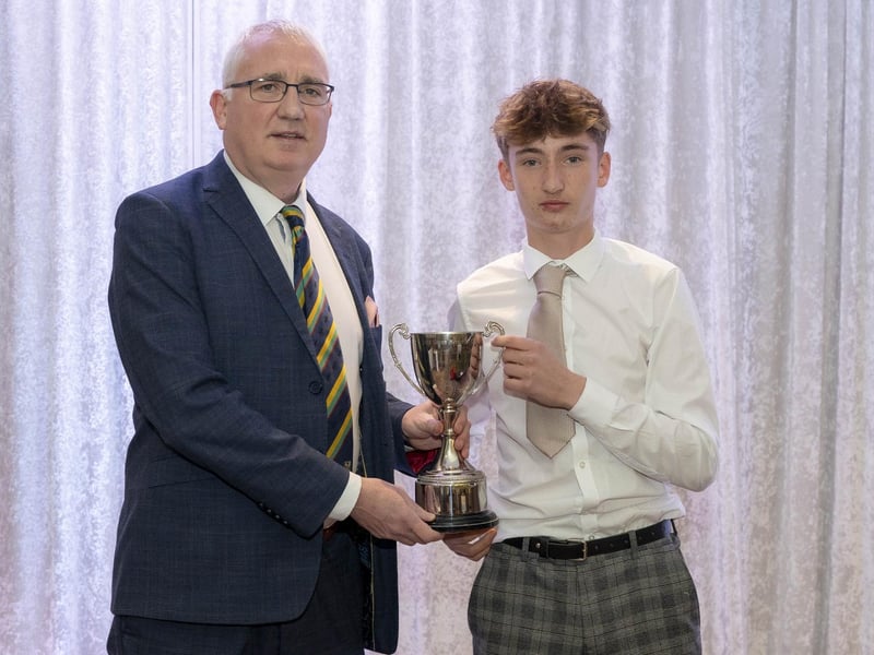 Bond's Glen's Sam Haslett receives the 'Jack Glenn Youth Player of the Year' award from from North West Cricket Chairman Brian Dougherty.