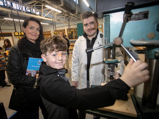 Drilling for success is P7 pupil Daniel O'Hara as mum Karen and Mr. Dylan Doherty look on at Saturday's St. Columb's College Open Day. (Photos: Jim McCafferty Photography)