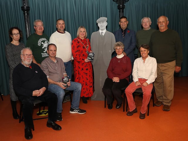 The Mayor of Derry City and Strabane District, Councillor Sandra Duffy, pictured with group at the launch of a new book titled 'Captain Kokeritz -  An American Hero' held in the Tower Museum. Seated from left are David Atherton, RNLI, David Jenkins, author and from right Amy Hardy, Marlene Donnell, family members who travelled from the US. Standing, from left are Bernadette Walsh, curator, Richard Rowe, Ken Donnell and from right, Jim Hardy, John Wade, Irish United Nations Veteran Association, and guest speaker Nigel Hagon, facilitator with the International School for Peace Studies. (Photo - Tom Heaney, nwpresspics)(Photo - Tom Heaney, nwpresspics)