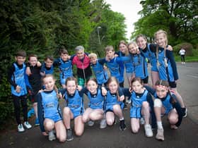 The legend that is Roisin Lynch pictured with the Hollybush Cross Country team on Friday. (Photos: jim McCafferty Photography)