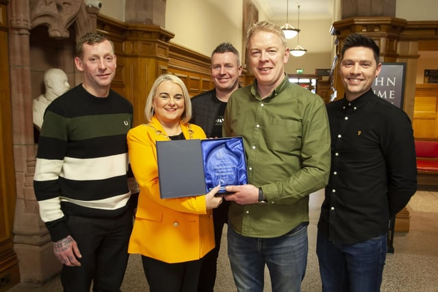 The Mayor of Derry City and Strabane District Council, Sandra Duffy makes a special presentation to Cahir Duffy, St. Joseph’s Boxing Club to mark the club’s celebration of 30 years in existence, during a reception in the Guildhall on Thursday night last. Included from left are Kwevin McIntyre, Ryan Tracey and Davy McFadden.