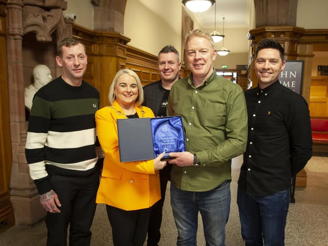 The Mayor of Derry City and Strabane District Council, Sandra Duffy makes a special presentation to Cahir Duffy, St. Joseph’s Boxing Club to mark the club’s celebration of 30 years in existence, during a reception in the Guildhall on Thursday night last. Included from left are Kwevin McIntyre, Ryan Tracey and Davy McFadden.
