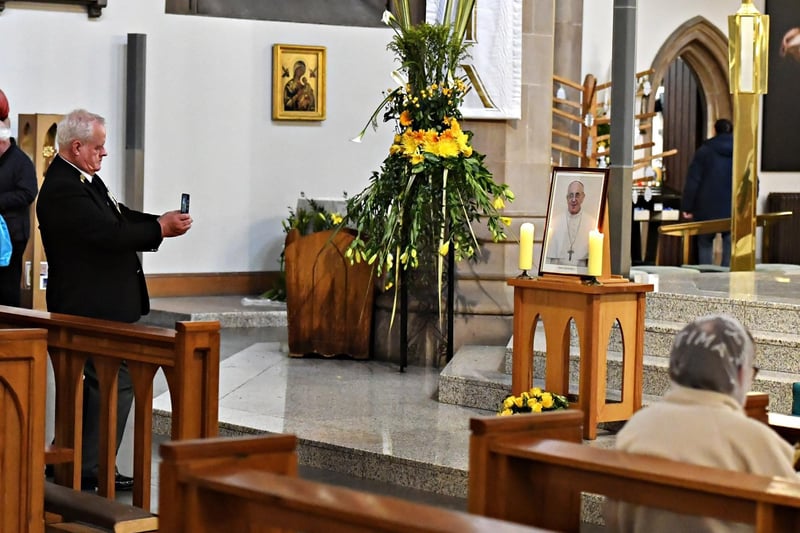 Man in St Eugene’s Cathedral, takes a picture of a photograph of Pope Frances, who  died early on Monday morning aged 88. Photo: George Sweeney