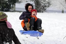 Sunday, November 28th 2010. Snow covered Brooke Park, Derry. Pablo O'Connor and his mum Laura. Picture by Lorcan Doherty / Press Eye