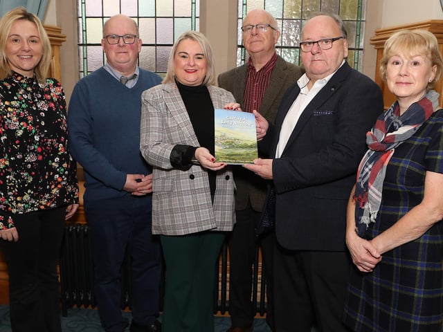 Mayor Sandra Duffy is presented with a copy of the book  "Casting A Long Shadow" (a people's history of Derry's Long Tower), from right, co-authors  Ivor Doherty, Joseph Martin and on left Martin McGeehan when they visited the Mayor's Parlour. Included left Erin Hutcheon and on right Philly Barwise, joint editors. (Photo - Tom Heaney, nwpresspics)