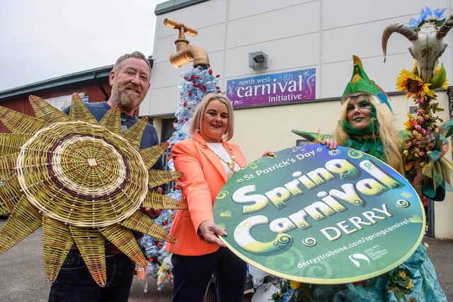 The Mayor Councillor Sandra Duffy and Jim Collins from the North West Carnival Initiative with Leeann Toland  who is transformed as she becomes  Danu the Gaelic Mother Earth at the launch of Derry City and Strabane District Council’s Spring Carnival. Picture Martin McKeown. 17.02.23