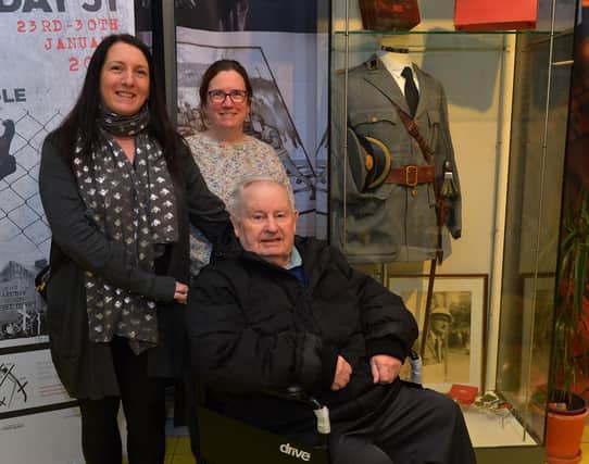 Former volunteer member of the Derry Corps of the Order of Malta Hugh Deehan, who was in the Bogside on Bloody Sunday, pictured with his daughters Roberta Deehan and Michelle Gallagher at the Order of Malta Exhibition launch in the Museum of Free Derry on Monday evening last. Photo: George Sweeney. DER2305GS – 48