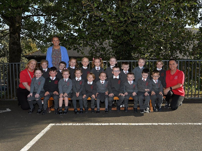 Teacher Miss Strathern (second from left) with P1 pupils and classroom assistants at Holy Family Primary School.