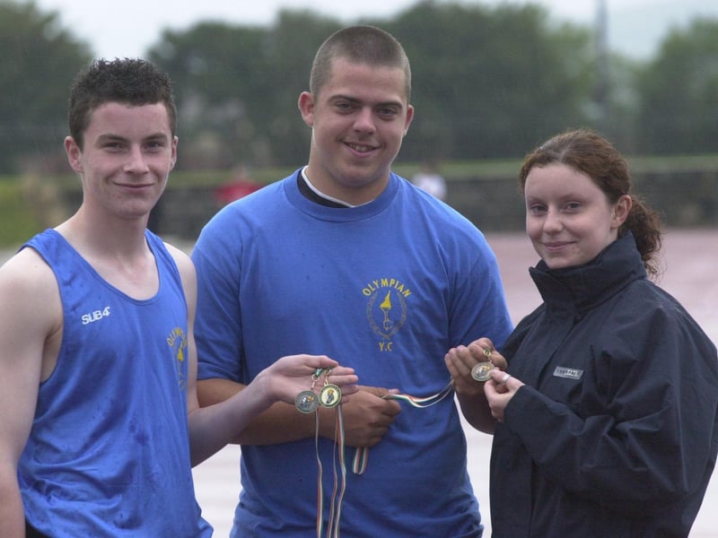 Members of Olympian Youth and Athletic Club who achieved medal success at the All Ireland Athletics Championships held in Tullamore. Included, from left, Patrick O'Donnoll, gold in the triple jump and bronze in the 300m, Lee Barlow, bronze in the javelin, and Michelle O'Donnoll, coach. Missing from picture is Shauna Donnelly, silver in the triple jump. (2907PG01) :Derry youngsters enjoying summer in August 2003