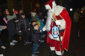 Santa greeting children at the Derry Christmas procession last year. Photo: George Sweeney. DER2248GS -  24