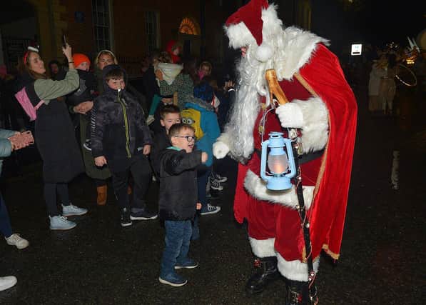 Santa greeting children at the Derry Christmas procession last year. Photo: George Sweeney. DER2248GS -  24