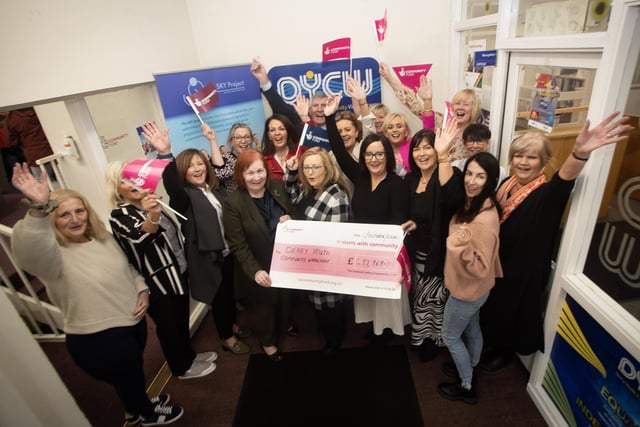 Management, staff and directors of Derry Youth and Community Workshop celebrate last week's announcement of their National Lottery Community Fund award of £497,969.00 for the Sky Project.