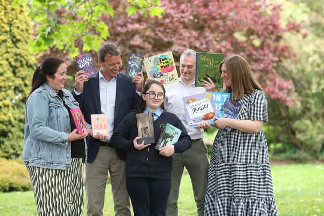 Caoilfhionn Carlin, pictured with her Reading Hero award, with her mother Karen, Tom Woods Head of Clients KPMG in Ireland, Gaelscoil na Daróige Principal, Fiachra Ó Donghaile and Elaina Ryan, CEO of Children’s Books Ireland.