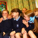 Education Minister Martin McGuinness pictured at St. Bernadette's in Ballymurphy in 2002 with pupils, Patricia McCrory, Michaela Doole and Chantelle Wally.
PHOTO STEVE WILSON/PACEMAKER