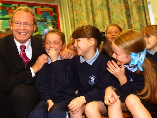 Education Minister Martin McGuinness pictured at St. Bernadette's in Ballymurphy in 2002 with pupils, Patricia McCrory, Michaela Doole and Chantelle Wally.
PHOTO STEVE WILSON/PACEMAKER