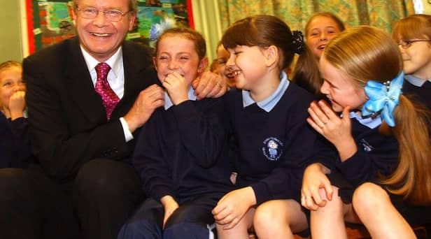 Education Minister Martin McGuinness pictured at St. Bernadette's in Ballymurphy in 2002 with pupils, Patricia McCrory, Michaela Doole and Chantelle Wally.
PHOTO STEVE WILSON/PACEMAKER