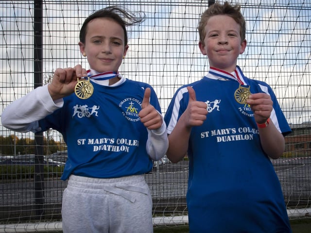Greenhaw PS pupils Amy Rose and Isaac pictured with their medals.