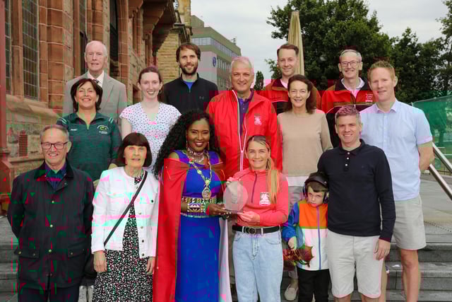 Mayor of Derry, Councillor Lilian Seenoi Barr, presenting a civic gift to Gemma Thompson, City of Derry Spartans Athletic Club, at in reception in the Guildhall following her recent success in winning 2 medals at the European Masters Indoor Championships in Poland. Gemma won the medals in the 200m and 60m setting an Irish Record. Included are fellow members of City of Derry Spartans AC. (Photo: Lorcan Doherty)Photo Lorcan Doherty