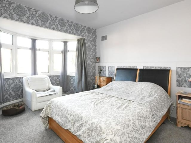 All three bedrooms are a good size. This is the master, with views overlooking the front of the £200,000 property. The floor is carpeted.